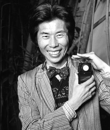 William Yang with light
meter at John Fink's
21st birthday, late 80s William Yang