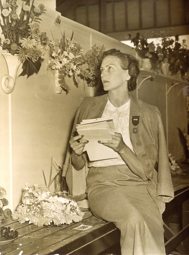 Helen Blaxland judging flower arrangements, c. 1940s