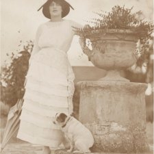 Rose Lindsay in garden at Springwood with Peter the fox terrier