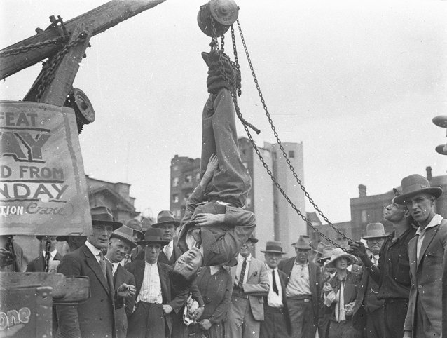 Murray the escapologist in a straight-jacket, 1928