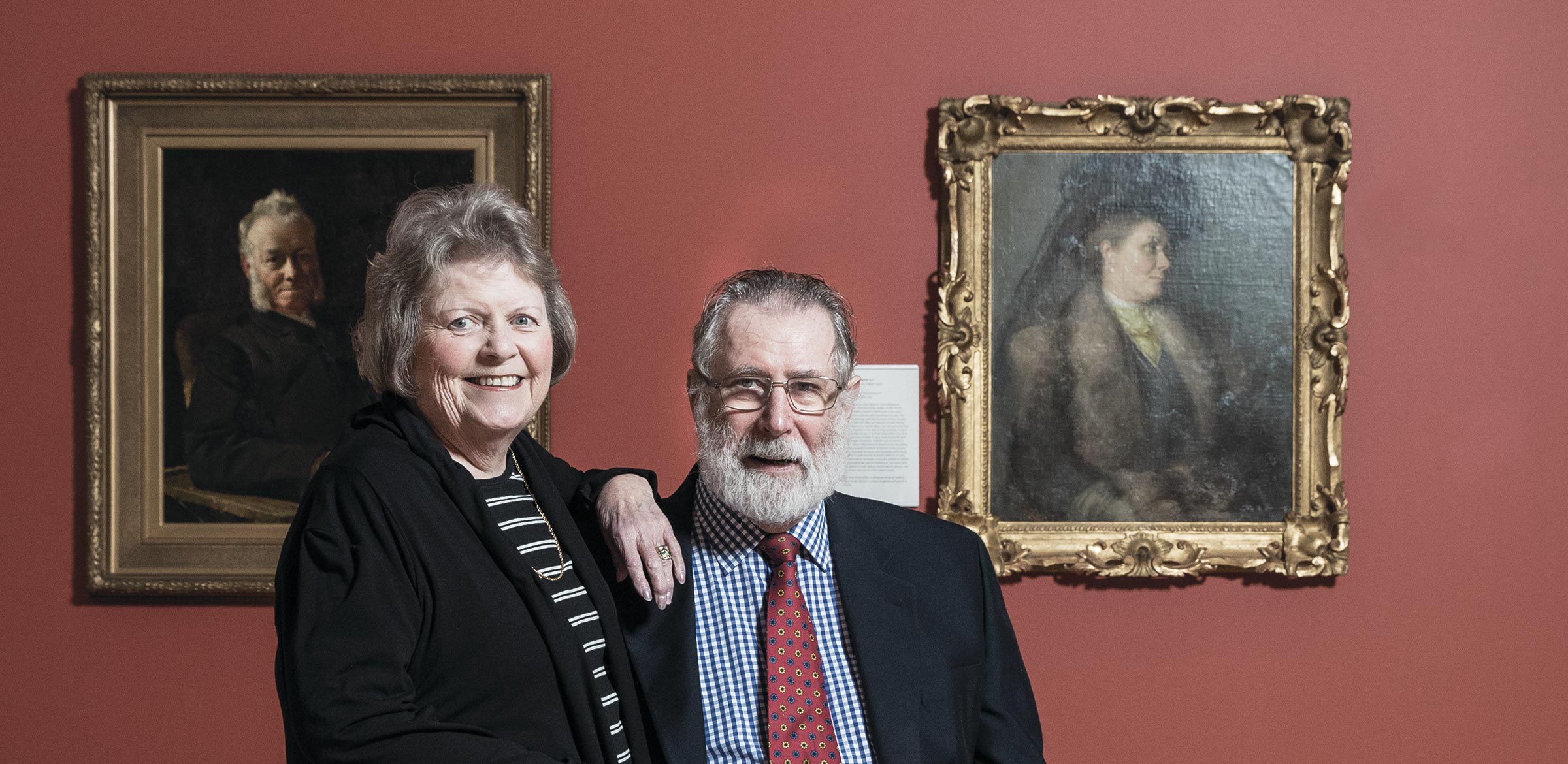 Gerry and Ted Kruger, Circle of Friends members, in front of Portrait of Mrs Tom Roberts 1910 by Tom Roberts. Purchased with the assistance of the Circle of Friends 2013.
