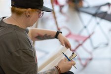 A woman with a pencil and drawing pad A woman with a pencil and drawing pad