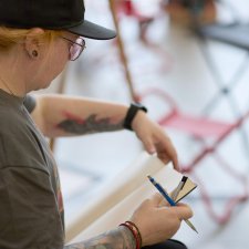 A woman with a pencil and drawing pad A woman with a pencil and drawing pad