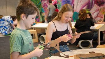 Children crafting with scissors