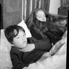 Dylan & Sarah in bed, 2024 Ryan Dandelion