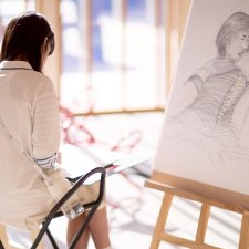 Drawing on paper at an easel in the Gordon Darling Hall Drawing on paper at an easel in the Gordon Darling Hall