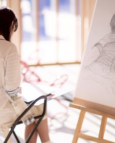 Drawing on paper at an easel in the Gordon Darling Hall