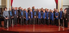 Rhythm Syndicate choir standing together on stage