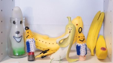 A collection of toys sitting on white shelves