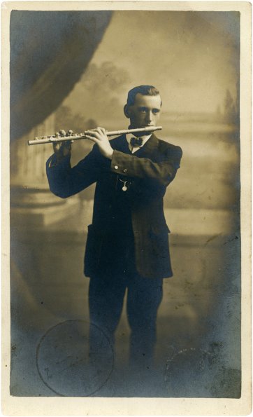Arthur Kean playing a flute, 1915 by Talma Studios, Ferdinand Sturgess