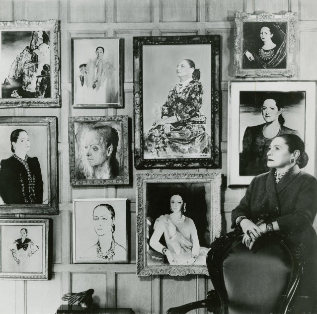 Helena Rubinstein with an artificial photomontage of part of her portrait collection, c. 1957