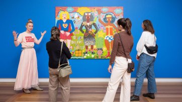 A group of people looking at Do you Believe in Love? 2025 by Kaylene Whiskey