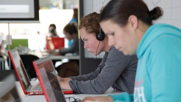 Two students using laptop computers