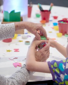 A child with crafting activities at a table A child with crafting activities at a table