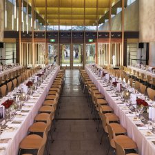 Long tables set for dinner in the Gordon Darling Hall