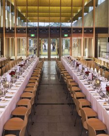 Long tables set for dinner in the Gordon Darling Hall