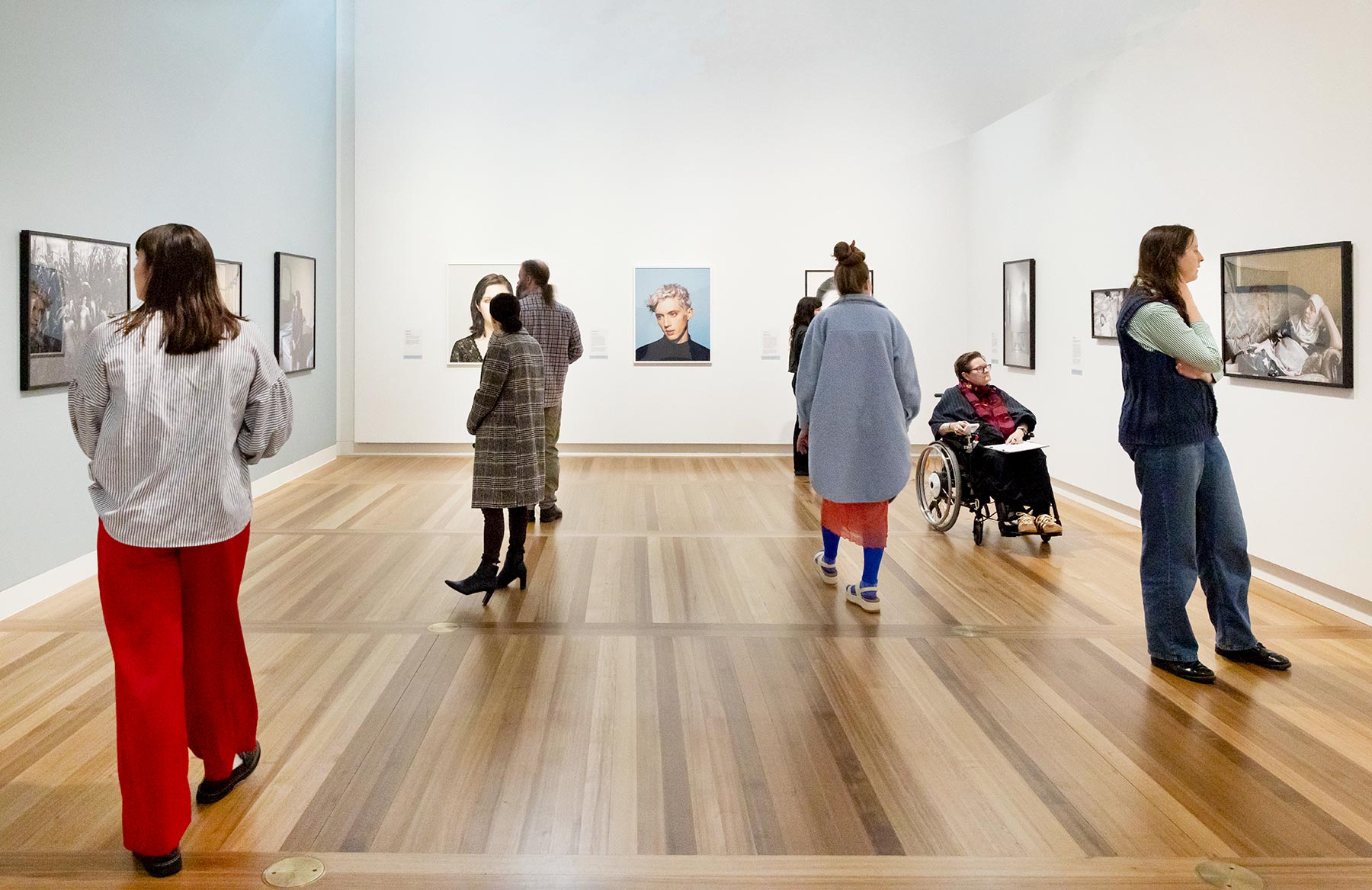 People viewing artworks in a gallery