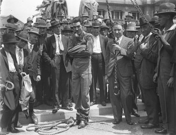 Murray frees himself from straightjacket in public, 1928 by Sam Hood