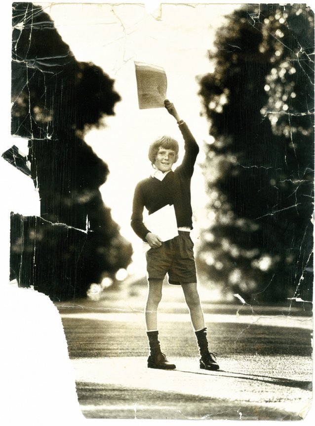 Peter Wilmoth, age 12, with copies of Our World 1974