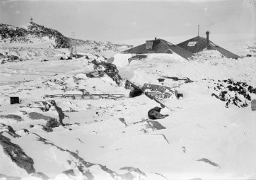 The AAE main base buried in deep snow , c. 1911-1914 Frank Hurley