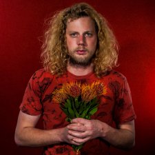 Self-portrait with flowers (presumed native), 2015 by Liam James