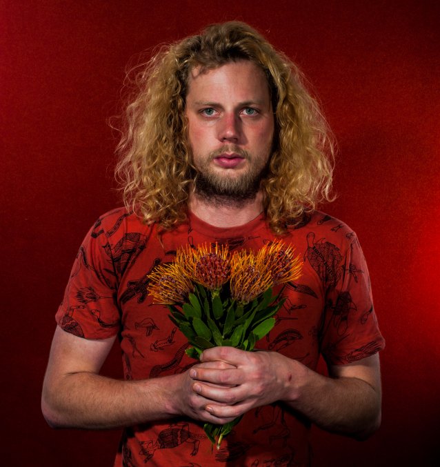 Self-portrait with flowers (presumed native), 2015