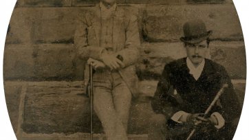 William St Leonards Robertson (standing) beside an unidentified man