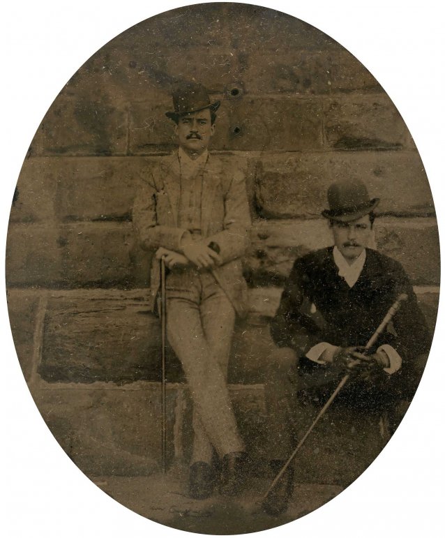 William St Leonards Robertson (standing) beside an unidentified man