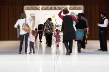Parents and children walking into the Gallery