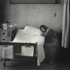 Woman patient next to bed asleep on pillow, 1979 Carol Jerrems
