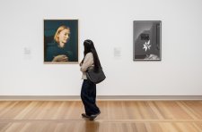 Visitor in the National Photographic Portrait Prize 2026 exhibition at the National Portrait Gallery, featuring works by finalists