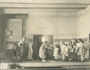 Louise Lovely with children during production of A Day in the Studio, c.1922