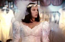 Toni Collette as Muriel trying on a wedding dress by Robert McFarlane, Muriel’s Wedding, 1994