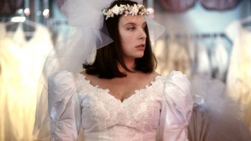 Toni Collette as Muriel trying on a wedding dress by Robert McFarlane, Muriel’s Wedding, 1994