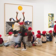 Children sitting in front of an artwork in Gallery Two Children sitting in front of an artwork in Gallery Two