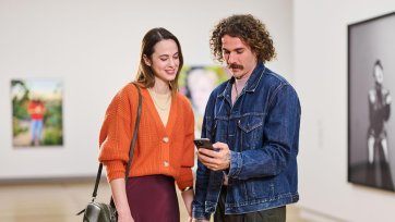 People looking at a phone app