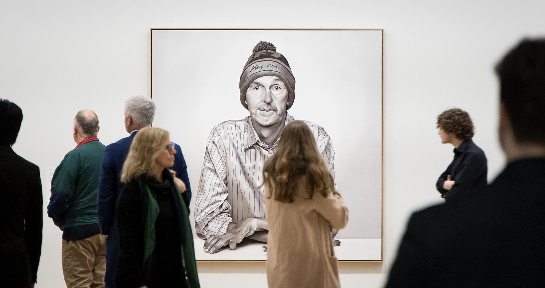 Circle of Friends viewing the portrait of Neale Daniher