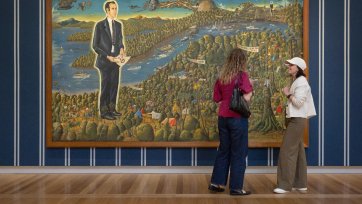 Visitors in the Power suits: The fit within the frame exhibition, May 2026, featuring Harold Thornton's Dr Brown and green Old Time Waltz 1983