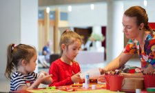 Children doing activities at a table in the gallery