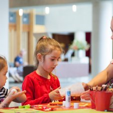 Children doing activities at a table in the gallery