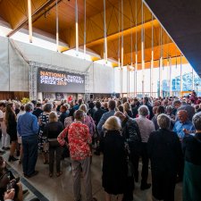 A large crowd of people in the Gordon Darling Hall for the National Photographic Portrait Prize launch in 2019