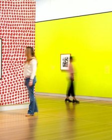 Two people looking at artworks