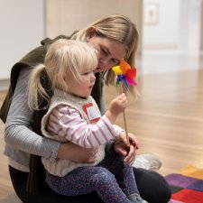A child playing with a flower in the Gallery
