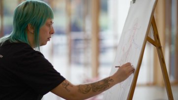Drawing at an easel