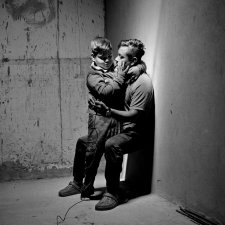 Carlos Soyos, 34, a migrant from Guatemala City, Guatemala and his son, Enderson Soyos, 8, take a self portrait at El Buen Samaritano migrants shelter, Juarez, Chihuahua, Mexico, 2021 Adam Ferguson