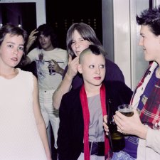 Guthugga Pipeline, Christmas Show, upstairs, The (old) Griffin Centre, Civic, 22 December 1979. Crowd, L-R : Ben Donaldson, Anne Redmond, Nick Vollis, Esa  Makela, Megan Woodrow (Mohawk), Andy Hall (scarf) 'pling